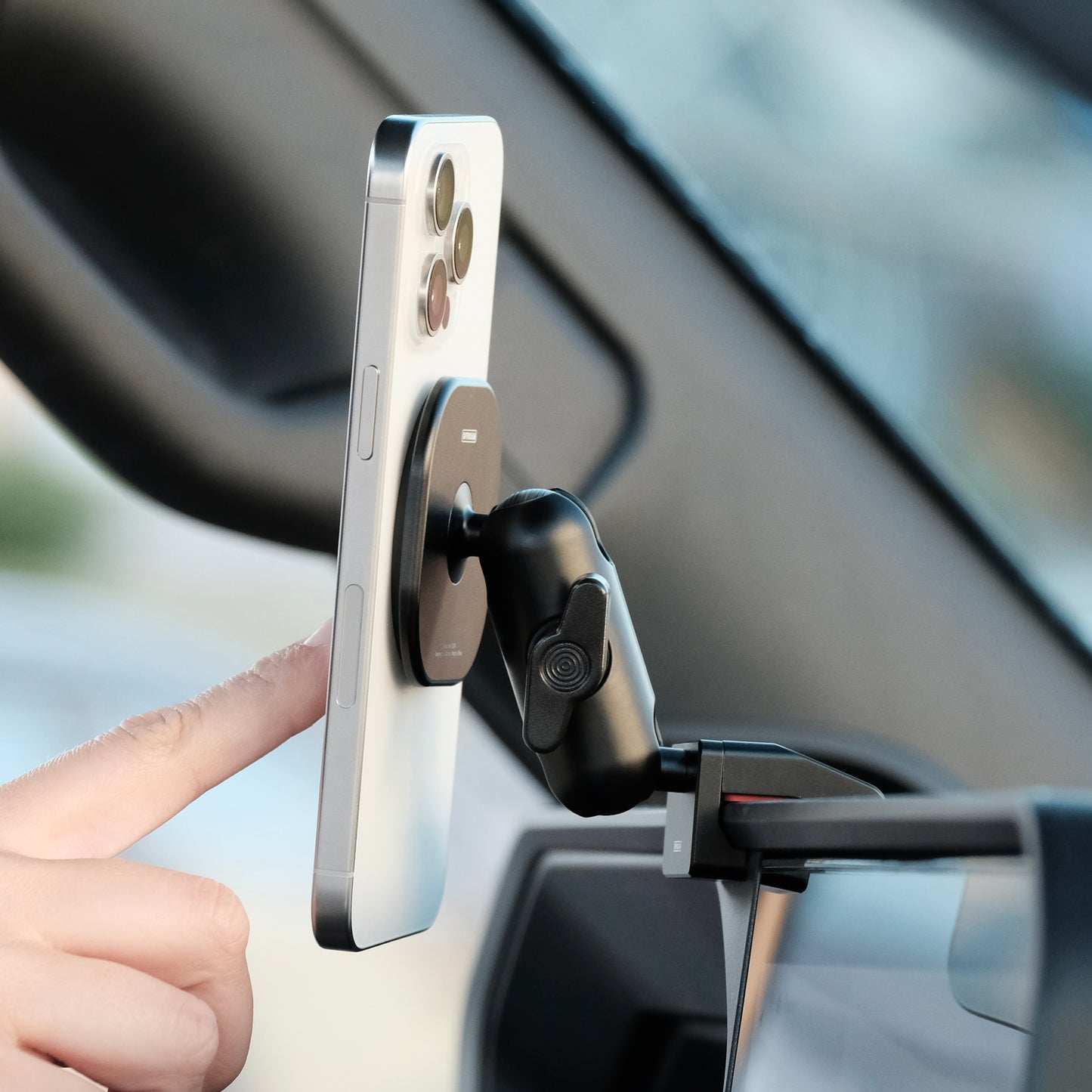 Image of Offroam MagSafe-compatible Phone Mount installed securely in Toyota Land Cruiser 250 2024-2025. This premium phone mount installs easily without drilling or glue. High force magnets hold phone on any trail, road, or track. Perfect placement without blocking screens, driver view, or air flow. Fully adjustable positioning.