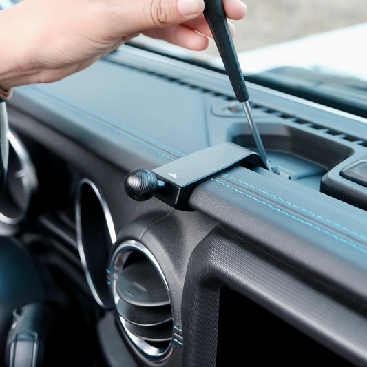 Image of Offroam Mounting Base installed securely in Jeep Wrangler 2018-2023 | Gladiator 2019-2023. This premium all metal phone mounting base installs easily without drilling or glue. Perfect placement without blocking screens, driver view, or air flow.