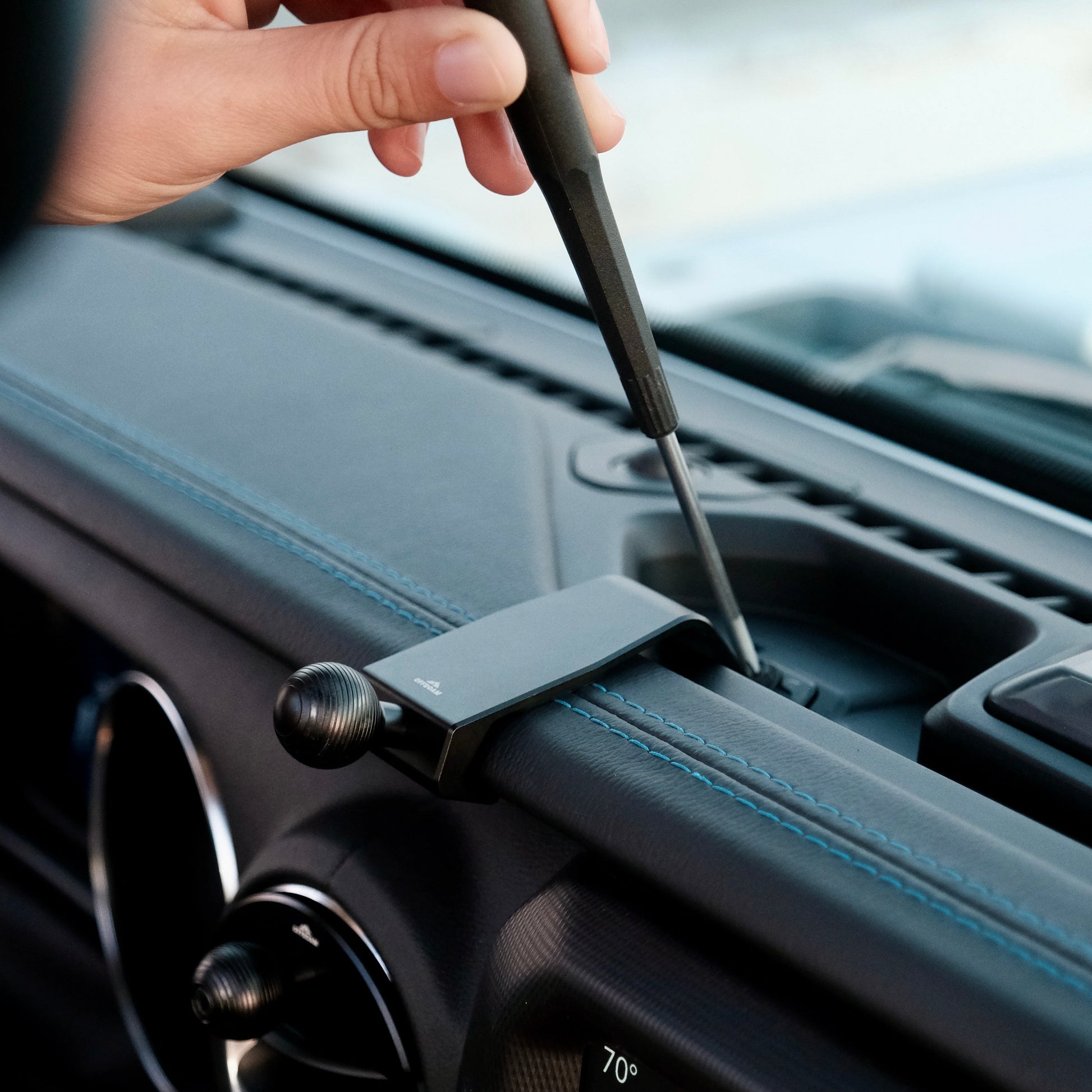 Image of Offroam Mounting Base installed securely in Jeep Wrangler 2018-2023 | Gladiator 2019-2023. This premium all metal phone mounting base installs easily without drilling or glue. Perfect placement without blocking screens, driver view, or air flow.