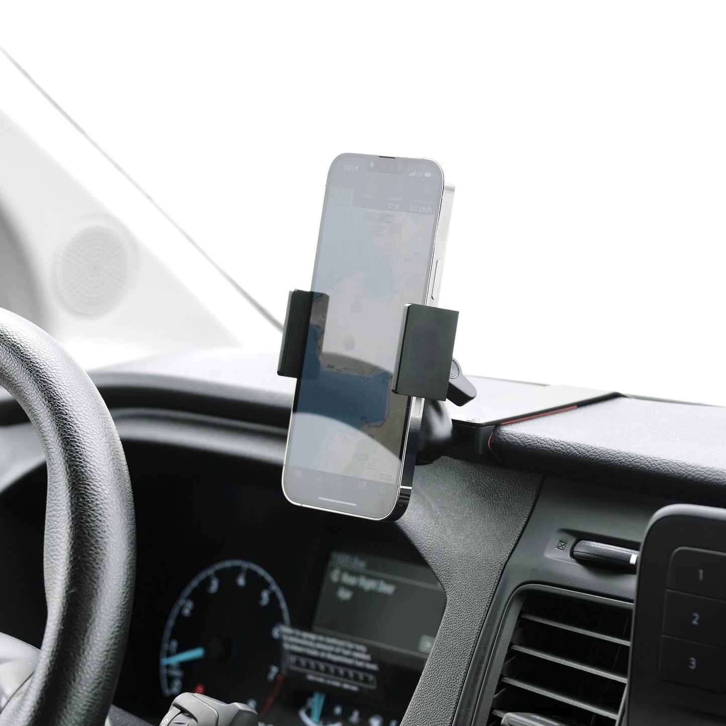 Image of Offroam Phone Mount installed securely in Ford Transit 2020-2025. This premium phone mount installs easily without drilling or glue. Spring loaded Universal holder for use with any phone. Perfect placement without blocking screens, driver view, or air flow. Fully adjustable positioning.