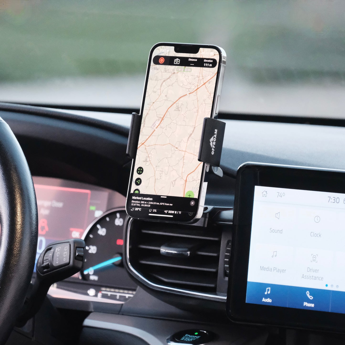 Image of Offroam Phone Mount installed securely in Ford Explorer 2020-2024. This premium phone mount installs easily without drilling or glue. Spring loaded Universal holder for use with any phone. Perfect placement without blocking screens, driver view, or air flow. Fully adjustable positioning.