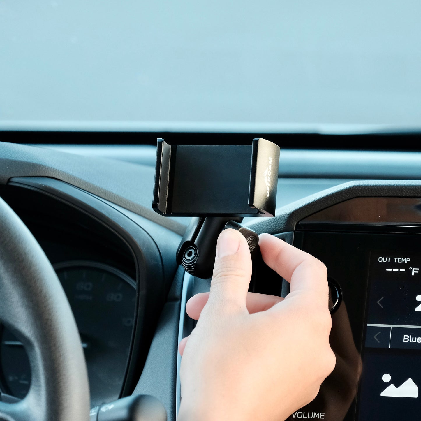 Image of Offroam Phone Mount installed securely in Subaru Crosstrek 2024-2026 | Impreza 2024-2026 | WRX 2022-2026. This premium phone mount installs easily without drilling or glue. Spring loaded Universal holder for use with any phone. Perfect placement without blocking screens, driver view, or air flow. Fully adjustable positioning.
