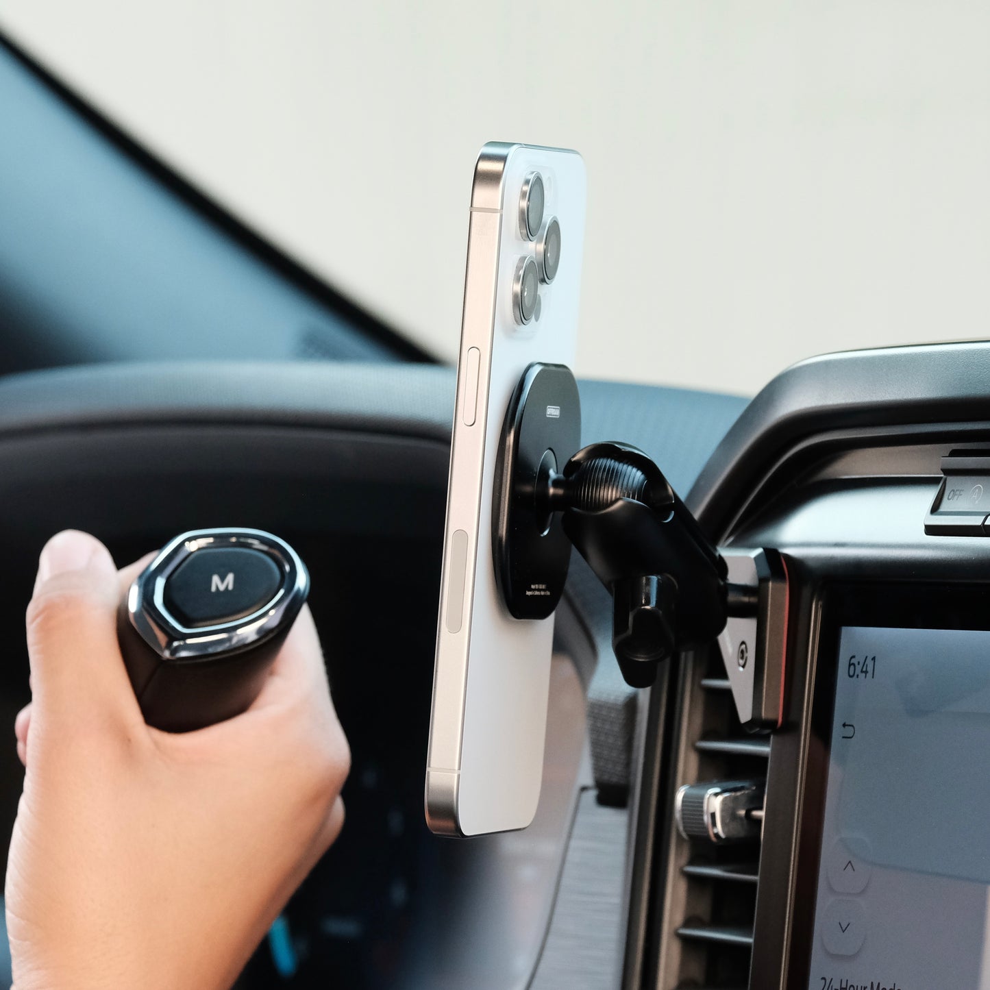 Image of Offroam MagSafe-compatible Phone Mount installed securely in Ford F-150 2021-2025 | F-250/F-350 2023-2025 | F-150 Lightning (XL & PRO) 2022-2025. This premium phone mount installs easily without drilling or glue. High force magnets hold phone on any trail, road, or track. Perfect placement without blocking screens, driver view, or air flow. Fully adjustable positioning.