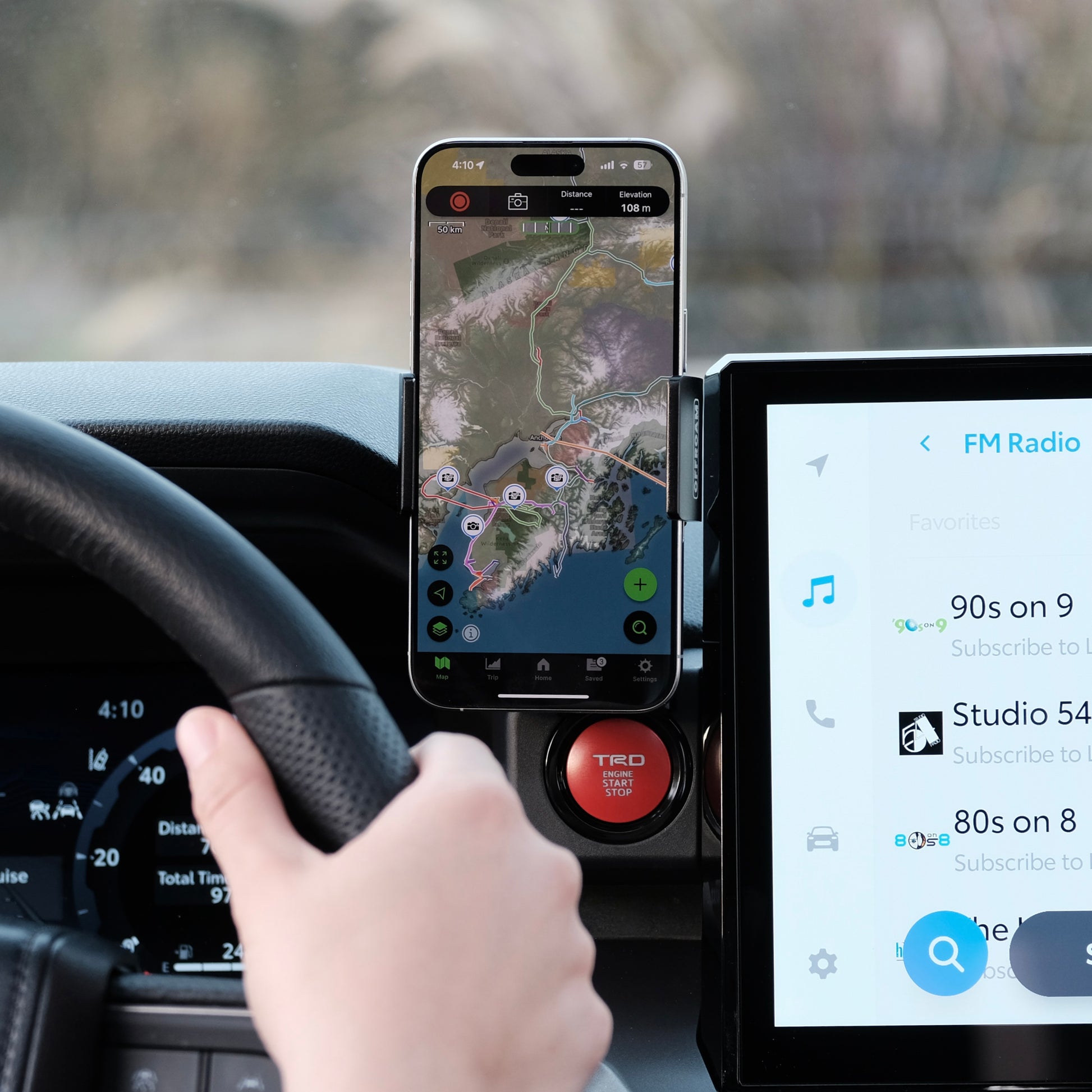 Image of Offroam Phone Mount installed securely in Toyota Tacoma 2024-2025 | 4Runner 2025. This premium phone mount installs easily without drilling or glue. Spring loaded Universal holder for use with any phone. Perfect placement without blocking screens, driver view, or air flow. Fully adjustable positioning.