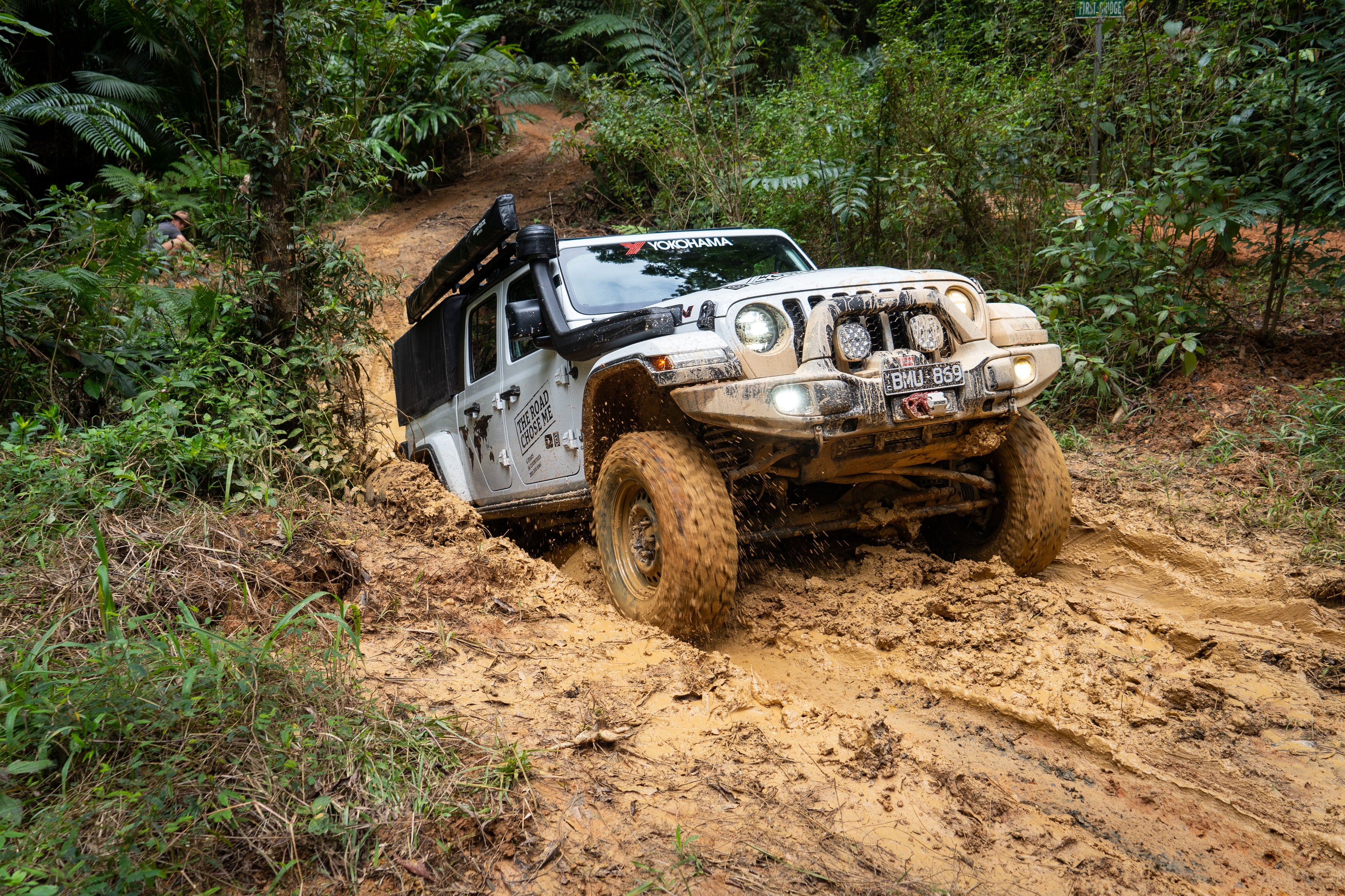 Image of Jeep Gladiator on a muddy trail. Offroam premium phone mounts install easily without drilling or glue. Spring loaded Universal holder or MagSafe-compatible holder with high force magnets hold phone on any trail, road, or track. Perfect placement without blocking screens, driver view, or air flow. Fully adjustable positioning.
