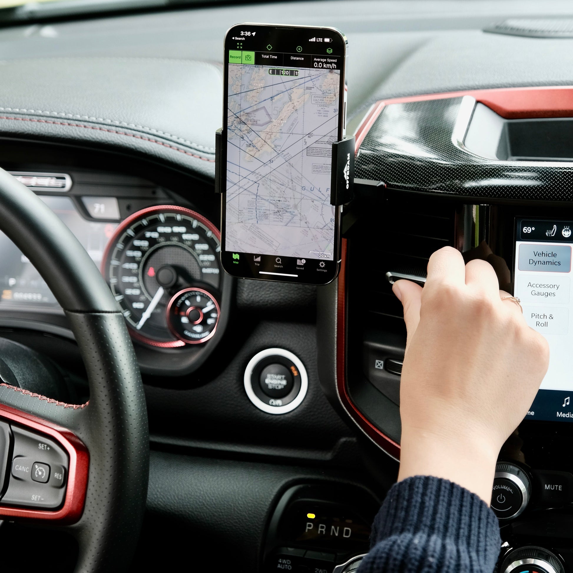 Image of Offroam Phone Mount installed securely in Ram 1500/2500/3500 2019-2025. This premium phone mount installs easily without drilling or glue. Spring loaded Universal holder for use with any phone. Perfect placement without blocking screens, driver view, or air flow. Fully adjustable positioning.