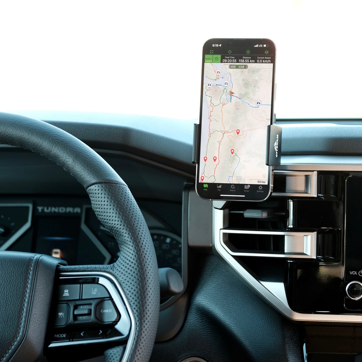 Image of Offroam Phone Mount installed securely in Toyota Tundra 2022-2025 | Sequoia 2023-2025. This premium phone mount installs easily without drilling or glue. Spring loaded Universal holder for use with any phone. Perfect placement without blocking screens, driver view, or air flow. Fully adjustable positioning.