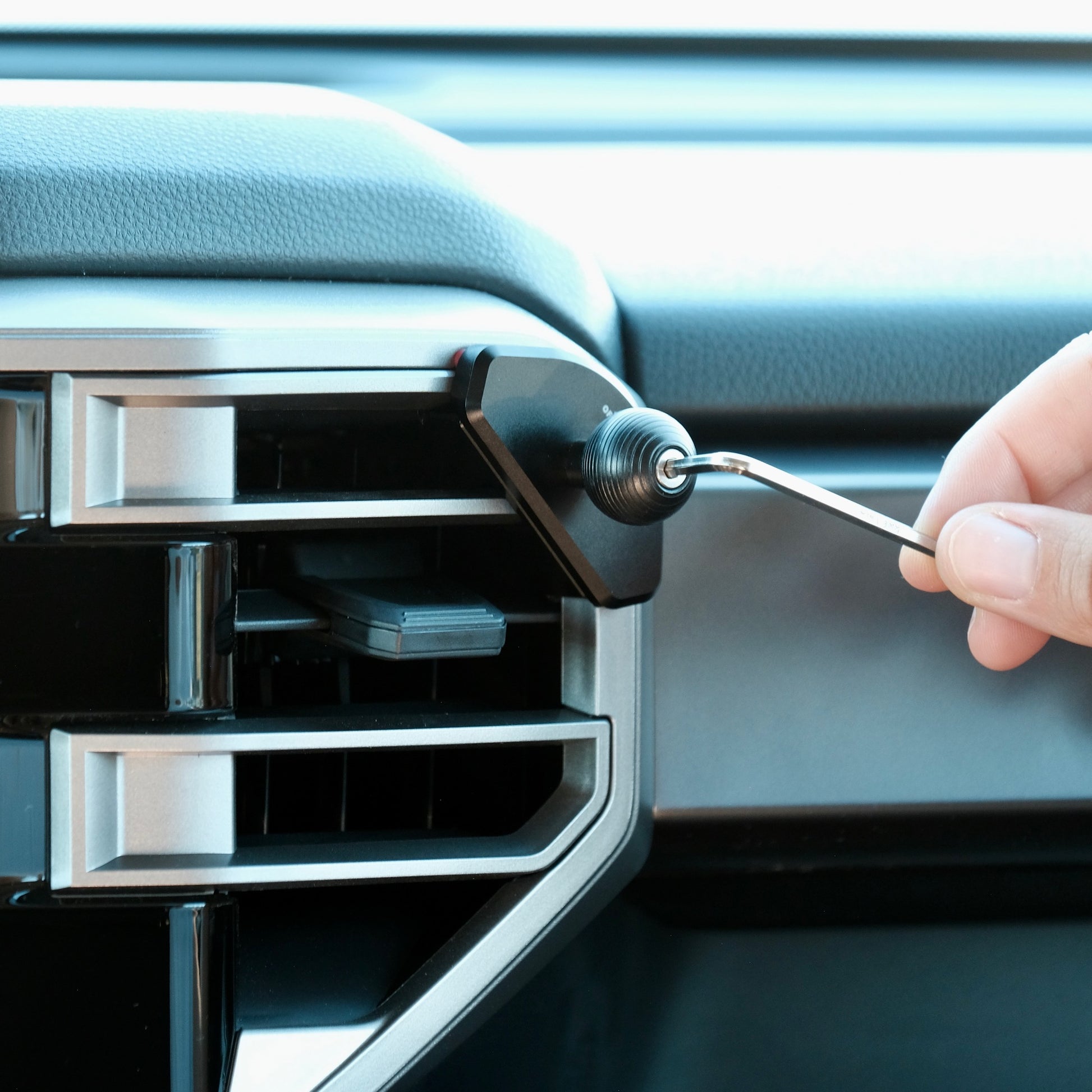 Image of Offroam Mounting Base installed securely in Toyota Tundra 2022-2025 | Sequoia 2023-2025. This premium all metal phone mounting base installs easily without drilling or glue. Perfect placement without blocking screens, driver view, or air flow.