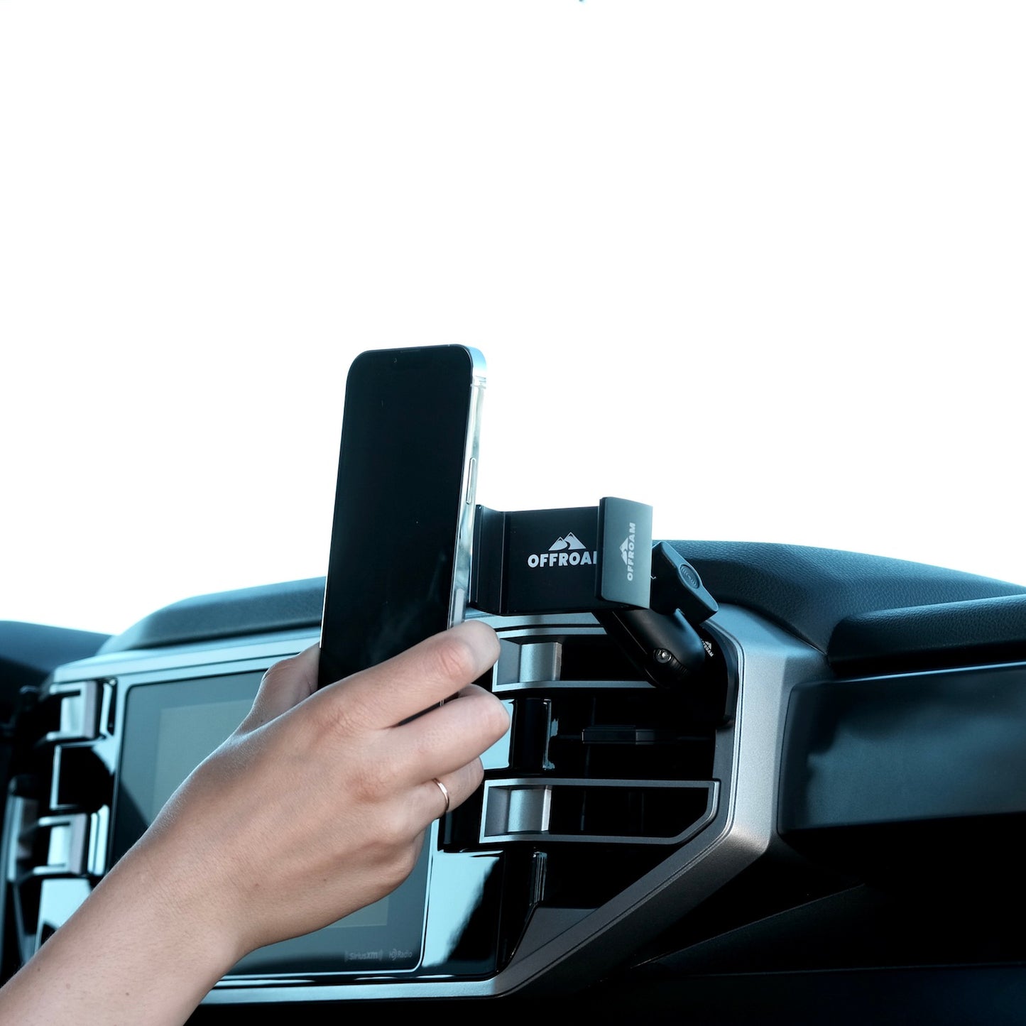 Image of Offroam Phone Mount installed securely in Toyota Tundra 2022-2025 | Sequoia 2023-2025. This premium phone mount installs easily without drilling or glue. Spring loaded Universal holder for use with any phone. Perfect placement without blocking screens, driver view, or air flow. Fully adjustable positioning.