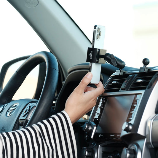 Image of Offroam Phone Mount installed securely in Toyota 4Runner 2010-2024. This premium phone mount installs easily without drilling or glue. Spring loaded Universal holder for use with any phone. Perfect placement without blocking screens, driver view, or air flow. Fully adjustable positioning.
