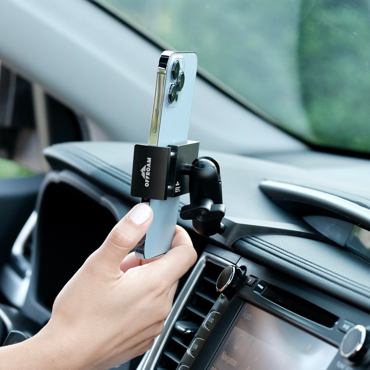 Image of Offroam Phone Mount installed securely in Toyota Highlander 2014-2019. This premium phone mount installs easily without drilling or glue. Spring loaded Universal holder for use with any phone. Perfect placement without blocking screens, driver view, or air flow. Fully adjustable positioning.