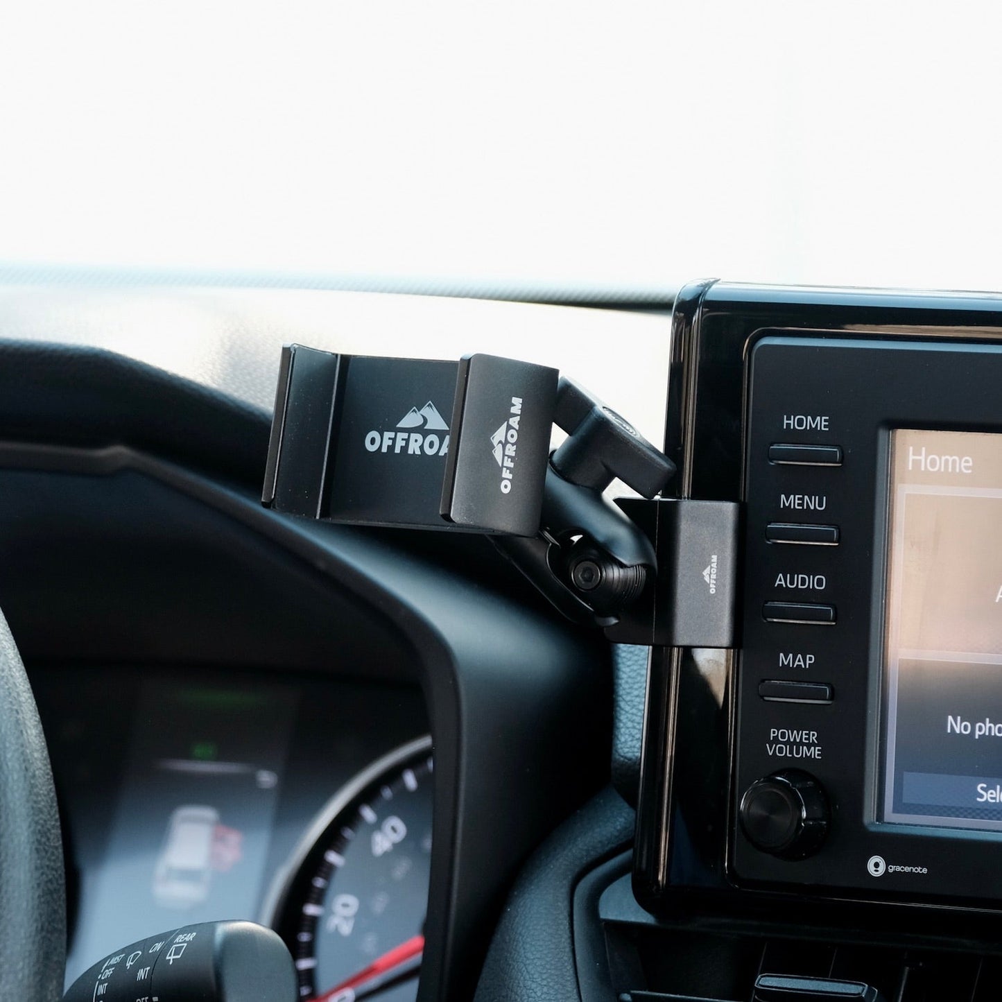 Image of Offroam Phone Mount installed securely in Toyota RAV4 2019-2025 with 7-in. or 8-in. Toyota Audio Multimedia. This premium phone mount installs easily without drilling or glue. Spring loaded Universal holder for use with any phone. Perfect placement without blocking screens, driver view, or air flow. Fully adjustable positioning.