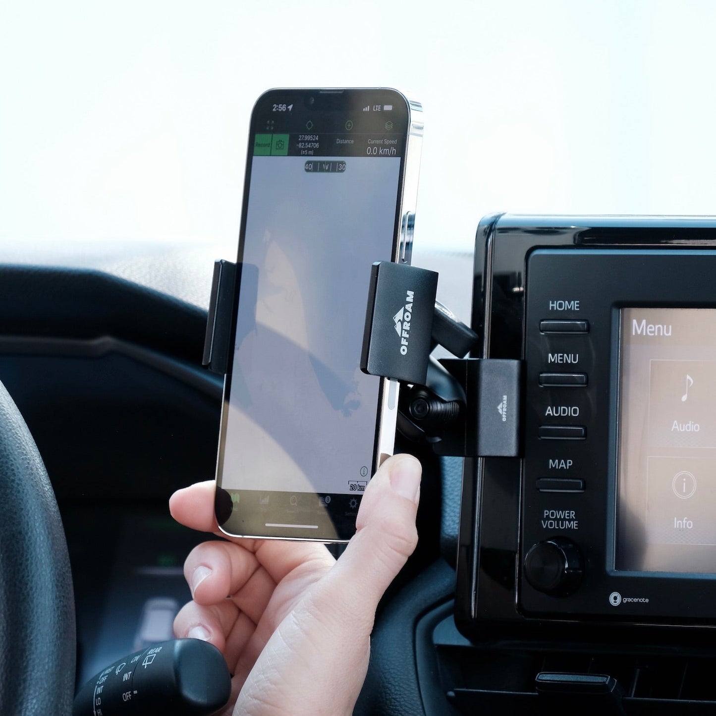 Image of Offroam Phone Mount installed securely in Toyota RAV4 2019-2025 with 7-in. or 8-in. Toyota Audio Multimedia. This premium phone mount installs easily without drilling or glue. Spring loaded Universal holder for use with any phone. Perfect placement without blocking screens, driver view, or air flow. Fully adjustable positioning.