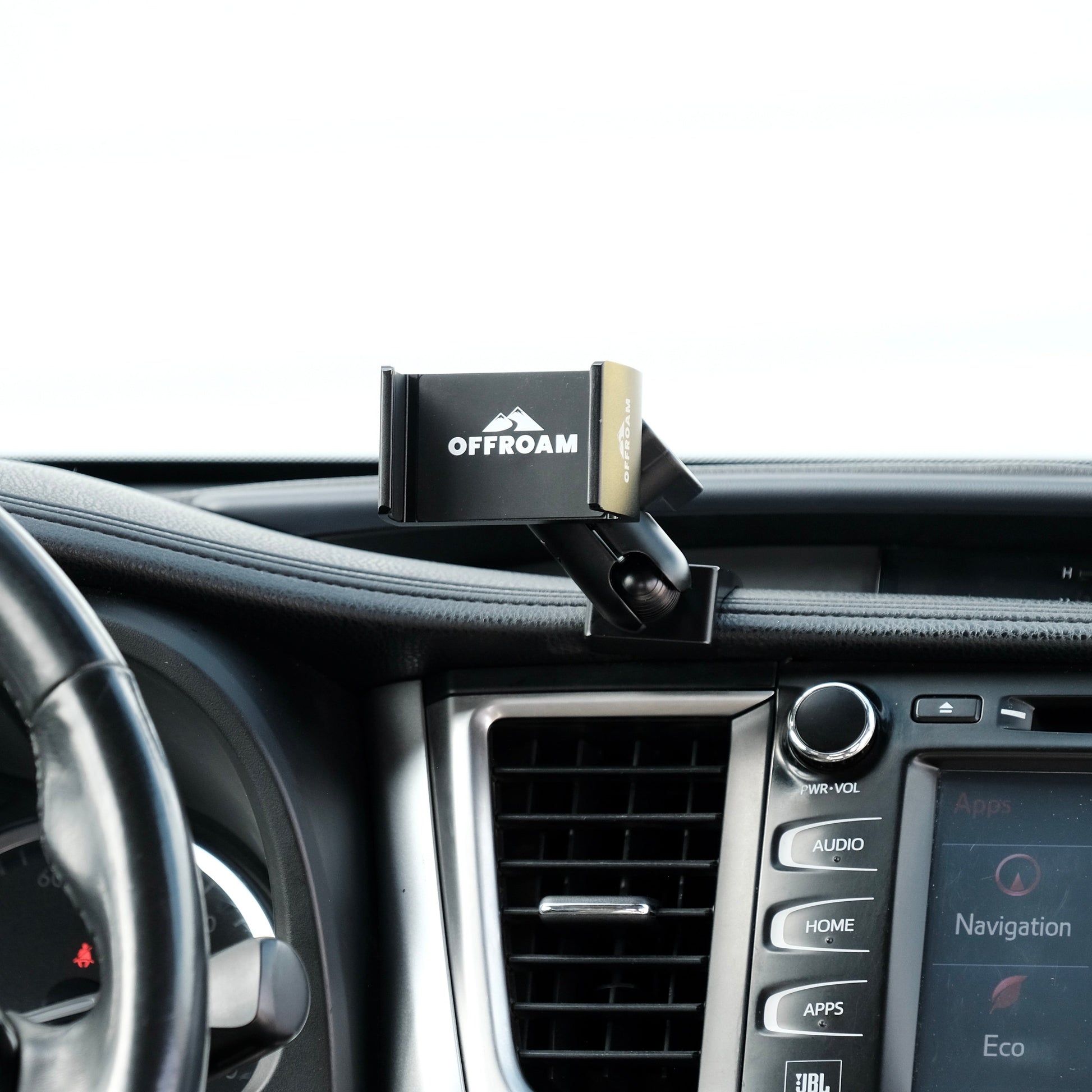 Image of Offroam Phone Mount installed securely in Toyota Highlander 2014-2019. This premium phone mount installs easily without drilling or glue. Spring loaded Universal holder for use with any phone. Perfect placement without blocking screens, driver view, or air flow. Fully adjustable positioning.