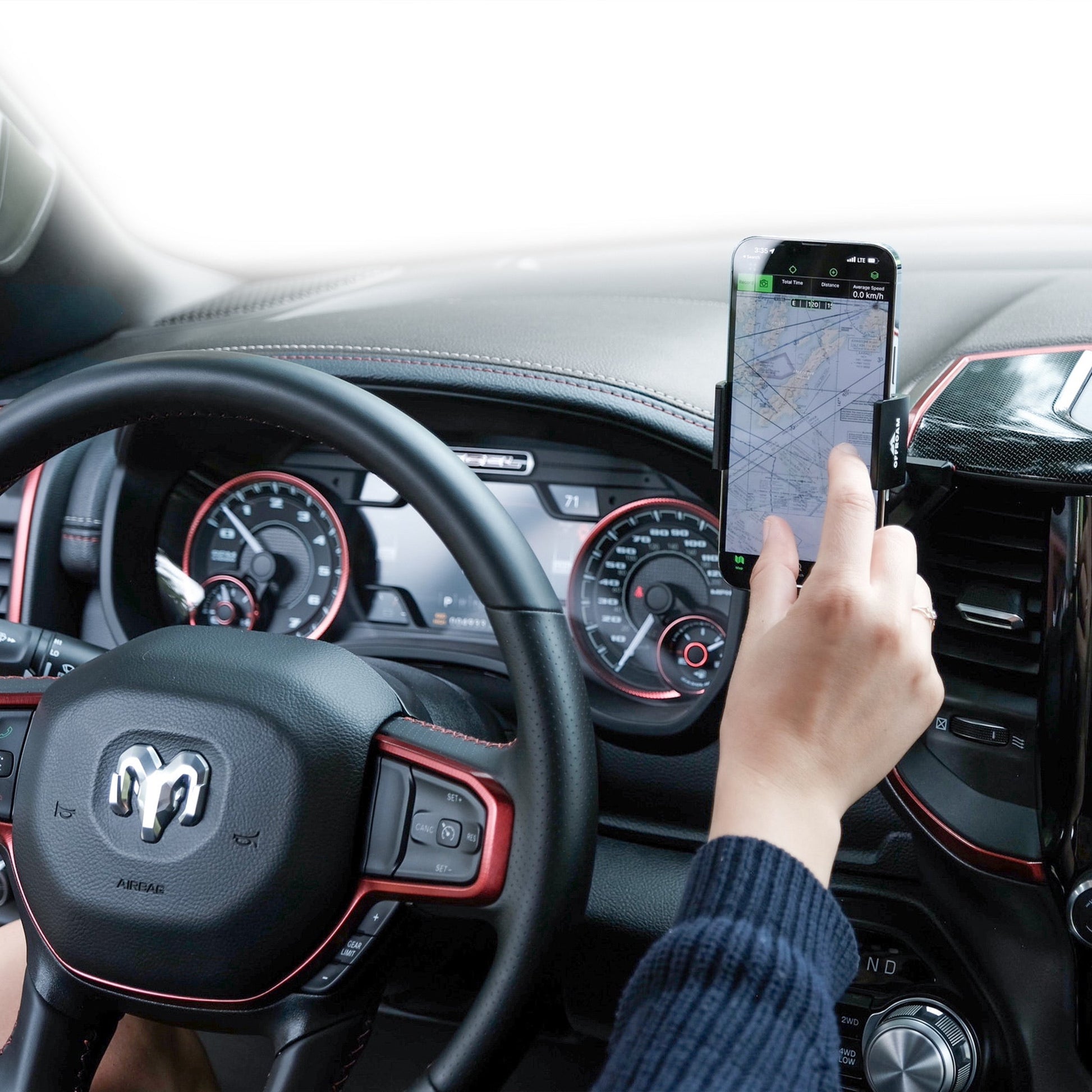 Image of Offroam Phone Mount installed securely in Ram 1500/2500/3500 2019-2025. This premium phone mount installs easily without drilling or glue. Spring loaded Universal holder for use with any phone. Perfect placement without blocking screens, driver view, or air flow. Fully adjustable positioning.