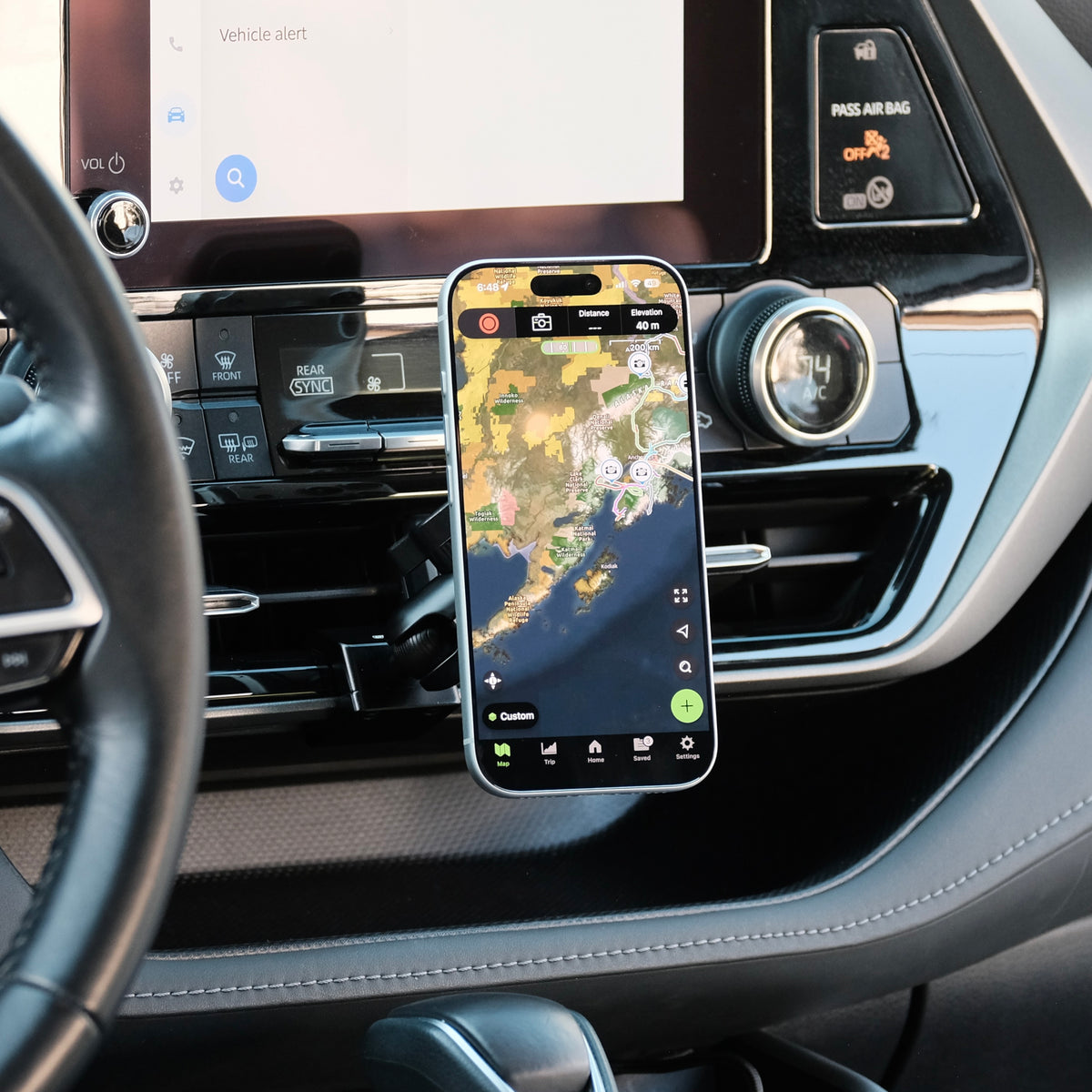 Image of Offroam MagSafe-compatible Phone Mount installed securely in Toyota Highlander 2020-2026. This premium phone mount installs easily without drilling or glue. High force magnets hold phone on any trail, road, or track. Perfect placement without blocking screens, driver view, or air flow. Fully adjustable positioning.