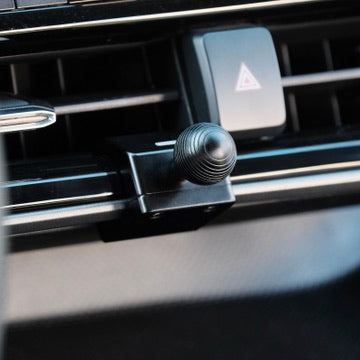 Image of Offroam Mounting Base installed securely in Toyota Highlander 2020-2026. This premium all metal phone mounting base installs easily without drilling or glue. Perfect placement without blocking screens, driver view, or air flow.
