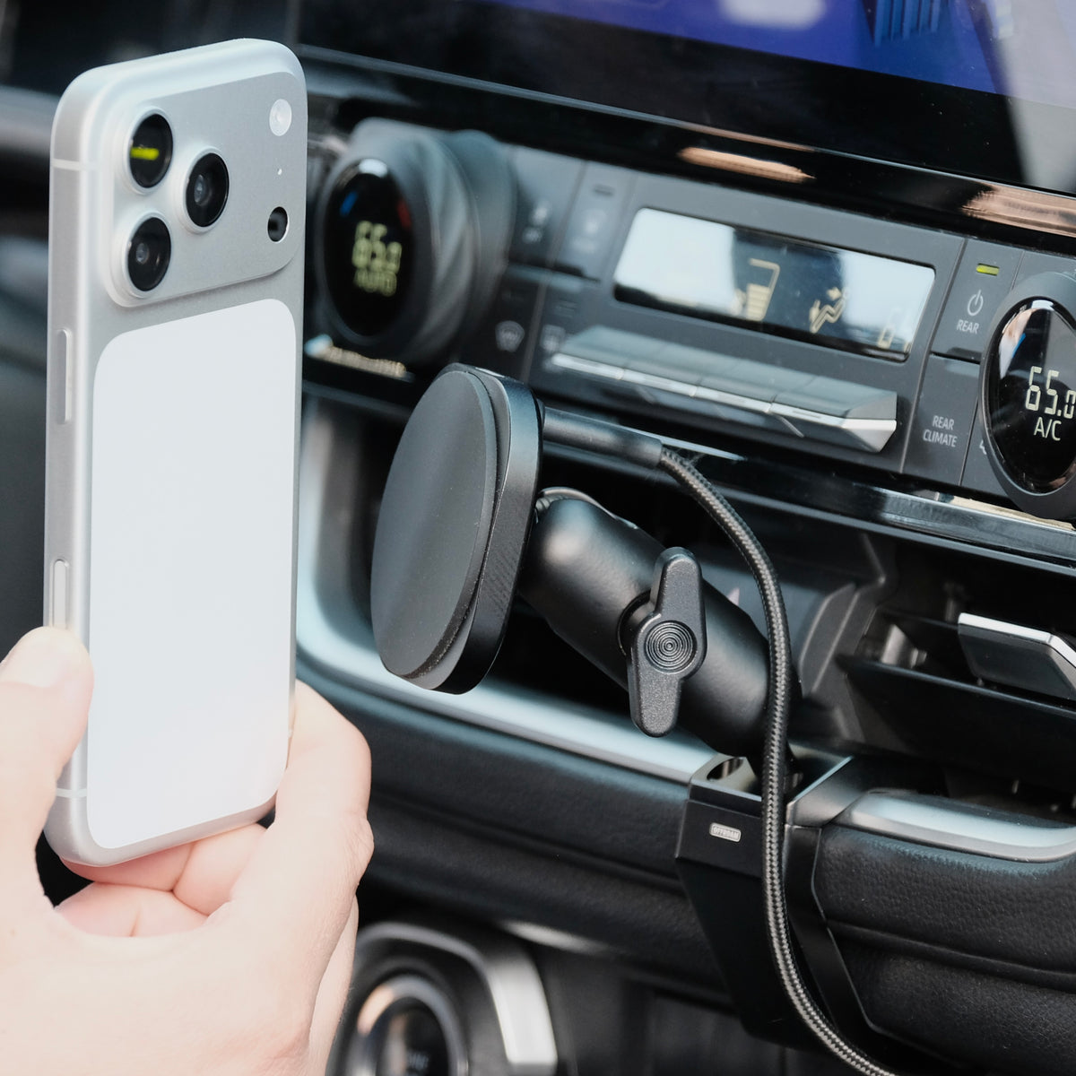 Image of Offroam MagSafe-compatible Phone Mount installed securely in Toyota Grand Highlander 2024-2026. This premium phone mount installs easily without drilling or glue. High force magnets hold phone on any trail, road, or track. Perfect placement without blocking screens, driver view, or air flow. Fully adjustable positioning.