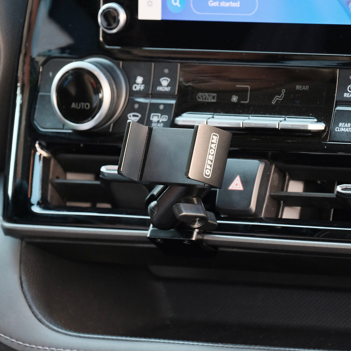 Image of Offroam Phone Mount installed securely in Toyota Highlander 2020-2026. This premium phone mount installs easily without drilling or glue. Spring loaded Universal holder for use with any phone. Perfect placement without blocking screens, driver view, or air flow. Fully adjustable positioning.