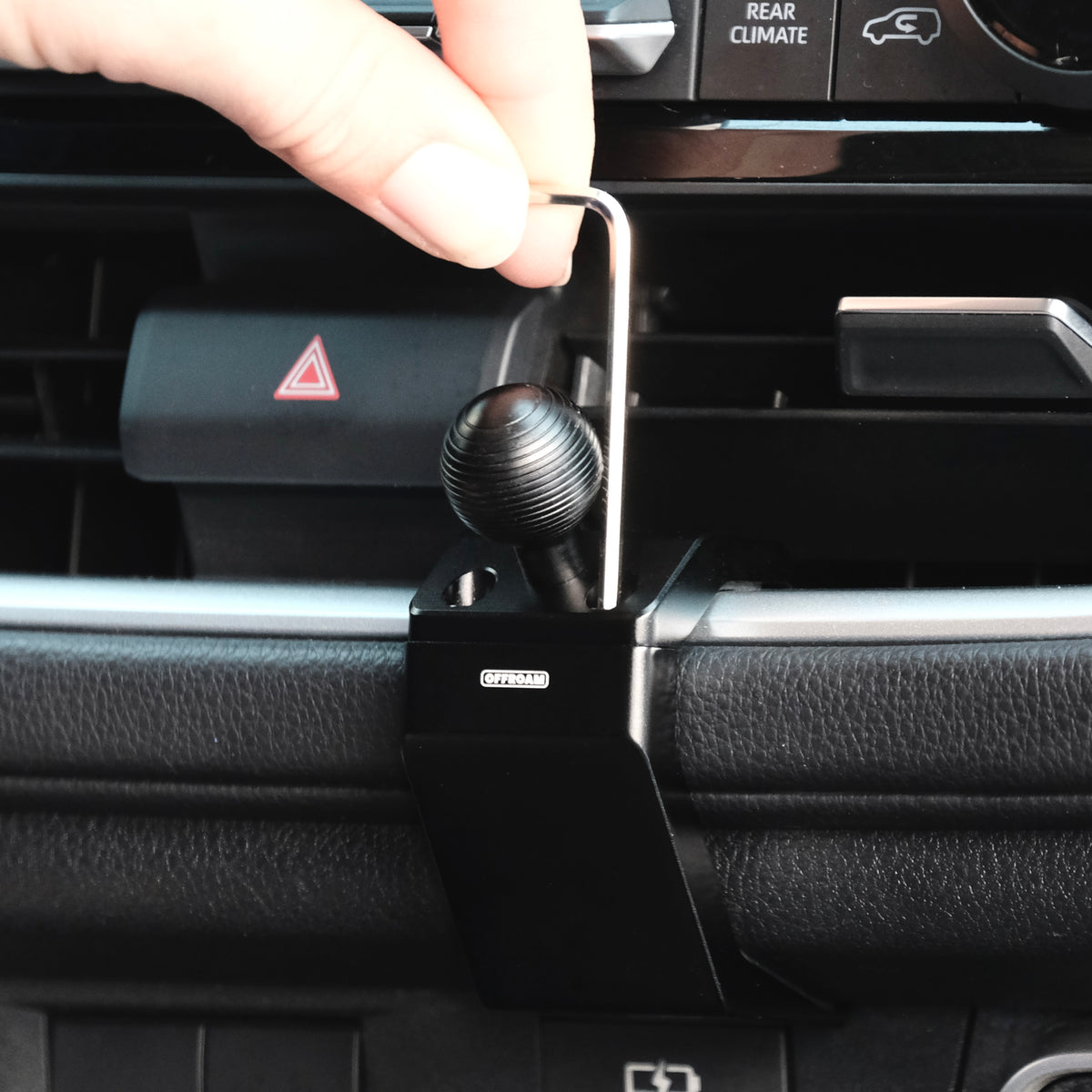 Image of Offroam Mounting Base installation in Toyota Grand Highlander 2024-2026. This premium all metal phone mounting base installs easily without drilling or glue. Perfect placement without blocking screens, driver view, or air flow.