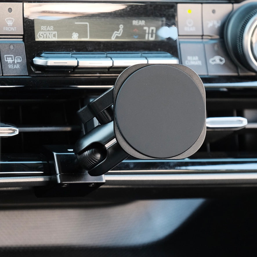 Image of Offroam MagSafe-compatible Phone Mount installed securely in Toyota Highlander 2020-2026. This premium phone mount installs easily without drilling or glue. High force magnets hold phone on any trail, road, or track. Perfect placement without blocking screens, driver view, or air flow. Fully adjustable positioning.