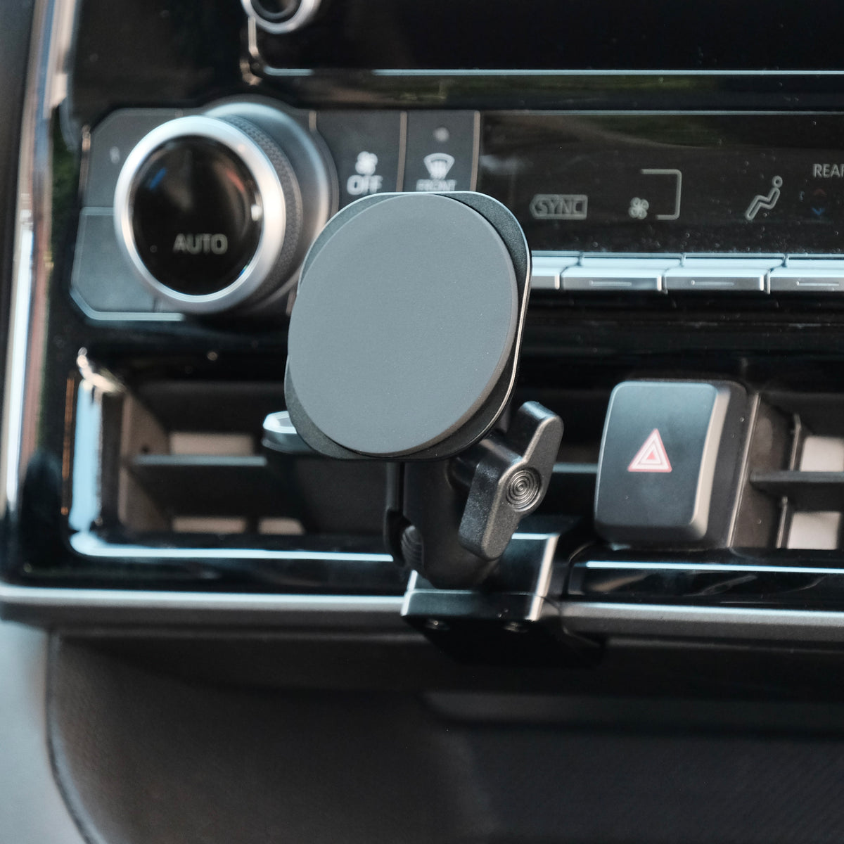 Image of Offroam MagSafe-compatible Phone Mount installed securely in Toyota Highlander 2020-2026. This premium phone mount installs easily without drilling or glue. High force magnets hold phone on any trail, road, or track. Perfect placement without blocking screens, driver view, or air flow. Fully adjustable positioning.