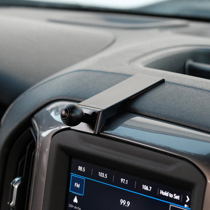 Image of Offroam Mounting Base installed securely in Chevrolet Silverado 2019-2026 | Silverado HD 2020-2026 & GMC Sierra 1500 2019-2026 | Sierra HD 2020-2026 with 7-in.|8-in. display. This premium all metal phone mounting base installs easily without drilling or glue. Perfect placement without blocking screens, driver view, or air flow.