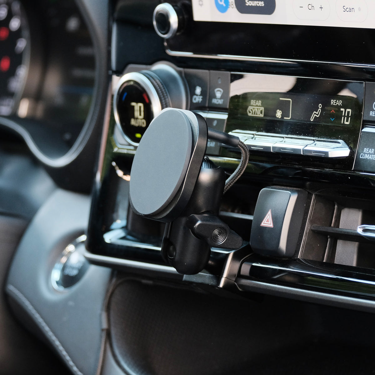 Image of Offroam MagSafe-compatible Phone Mount installed securely in Toyota Highlander 2020-2026. This premium phone mount installs easily without drilling or glue. High force magnets hold phone on any trail, road, or track. Perfect placement without blocking screens, driver view, or air flow. Fully adjustable positioning.