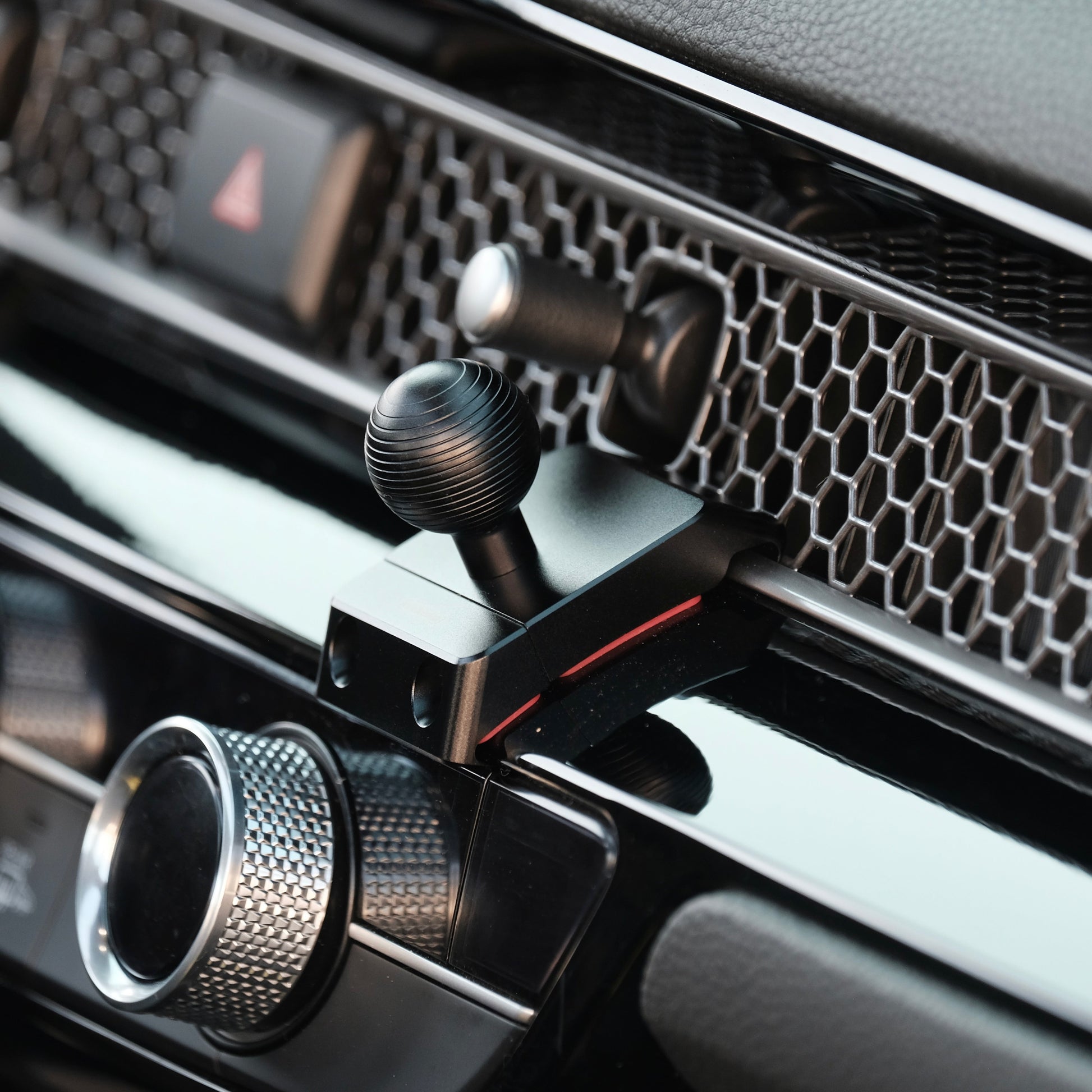 Image of Offroam Mounting Base installed securely in Honda Civic 2022-2025 | CR-V 2023-2025. This premium all metal phone mounting base installs easily without drilling or glue. Perfect placement without blocking screens, driver view, or air flow.