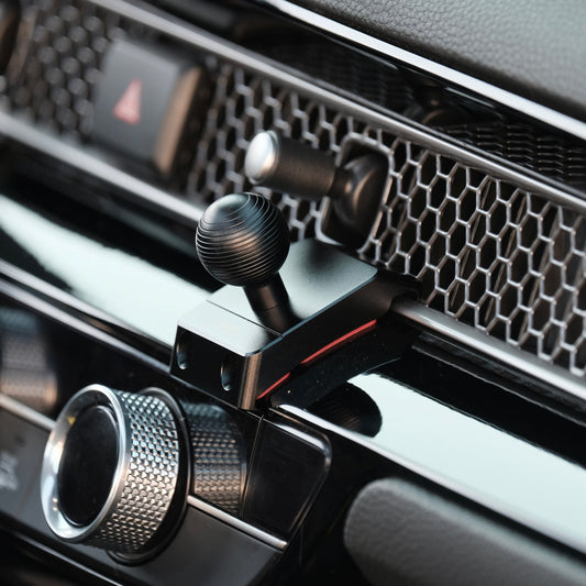Image of Offroam Mounting Base installed securely in Honda Civic 2022-2025 | CR-V 2023-2025. This premium all metal phone mounting base installs easily without drilling or glue. Perfect placement without blocking screens, driver view, or air flow.