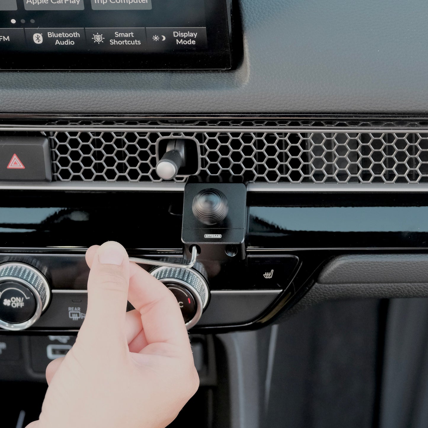 Image of Offroam Mounting Base installed securely in Honda Civic 2022-2025 | CR-V 2023-2025. This premium all metal phone mounting base installs easily without drilling or glue. Perfect placement without blocking screens, driver view, or air flow.