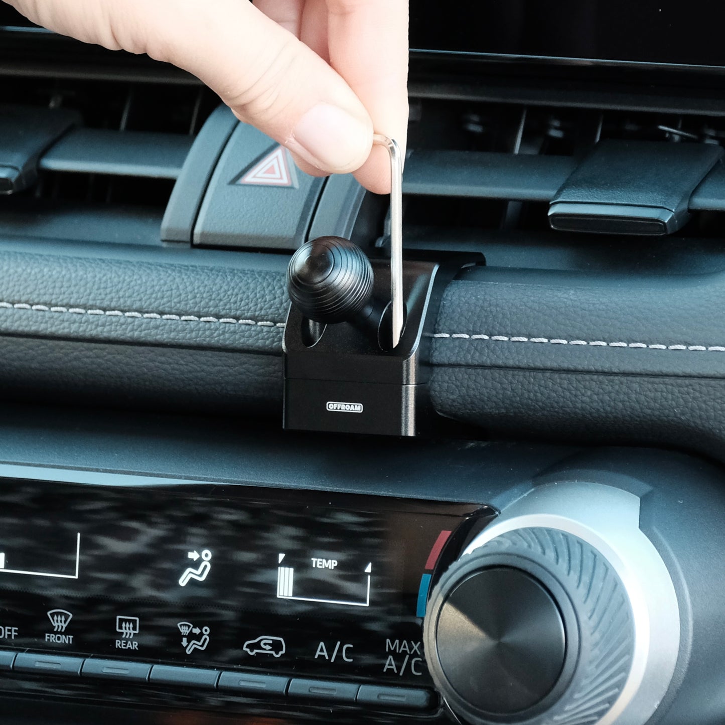 Image of Offroam Mounting Base installed securely in Toyota RAV4 2019-2025. This premium all metal phone mounting base installs easily without drilling or glue. Perfect placement without blocking screens, driver view, or air flow.