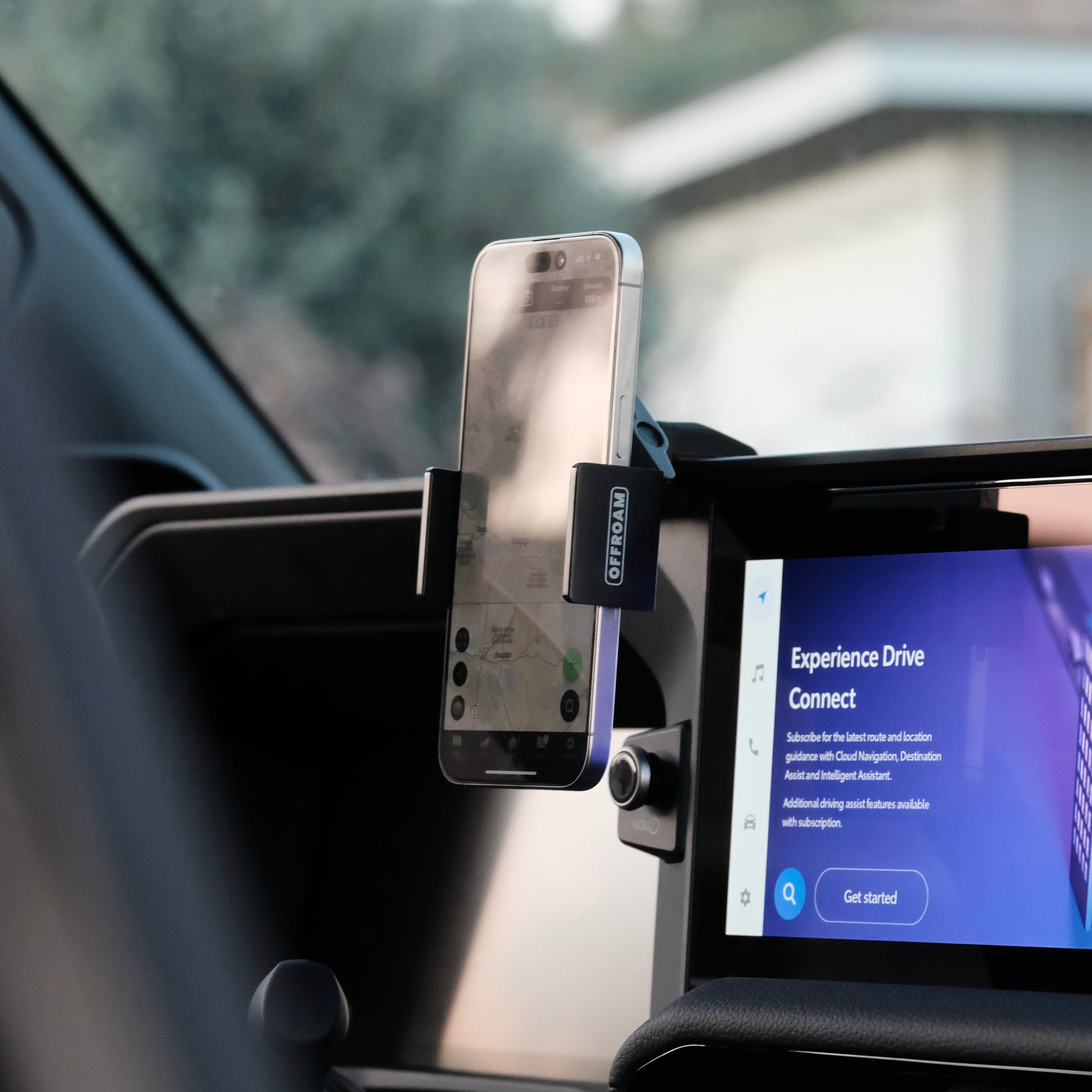 Image of Offroam Phone Mount installed securely in Toyota Land Cruiser 250 2024-2025. This premium phone mount installs easily without drilling or glue. Spring loaded Universal holder for use with any phone. Perfect placement without blocking screens, driver view, or air flow. Fully adjustable positioning.