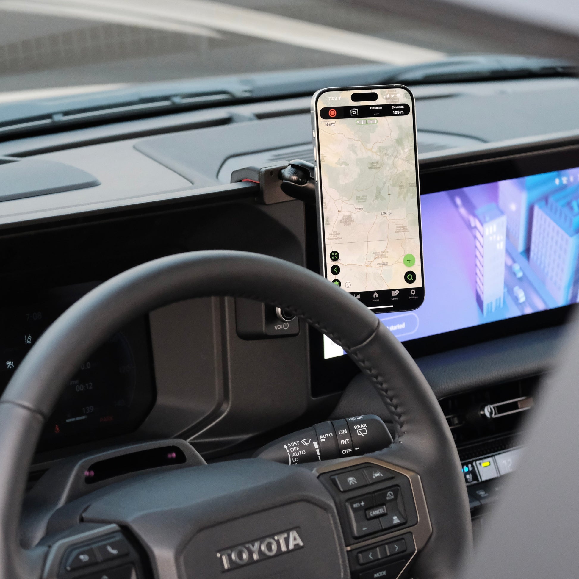 Image of Offroam MagSafe-compatible Phone Mount installed securely in Toyota Land Cruiser 250 2024-2025. This premium phone mount installs easily without drilling or glue. High force magnets hold phone on any trail, road, or track. Perfect placement without blocking screens, driver view, or air flow. Fully adjustable positioning.