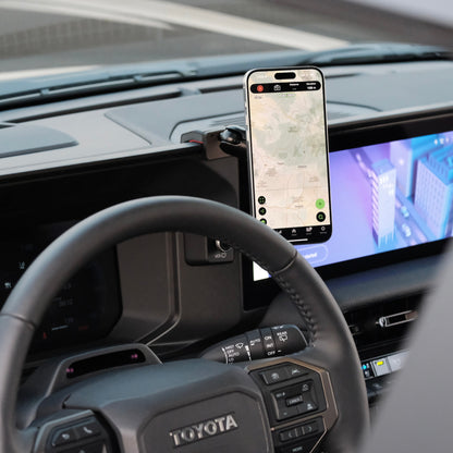 Image of Offroam MagSafe-compatible Phone Mount installed securely in Toyota Land Cruiser 250 2024-2025. This premium phone mount installs easily without drilling or glue. High force magnets hold phone on any trail, road, or track. Perfect placement without blocking screens, driver view, or air flow. Fully adjustable positioning.