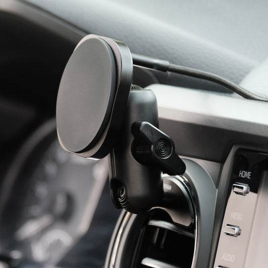 Image of Offroam MagSafe-compatible Phone Mount installed securely in Toyota Tacoma 2016-2023 | Tundra 2014-2021. This premium phone mount installs easily without drilling or glue. High force magnets hold phone on any trail, road, or track. Perfect placement without blocking screens, driver view, or air flow. Fully adjustable positioning.
