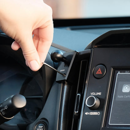 Image of Offroam Mounting Base installed securely in Subaru Forester 2025-2026. This premium all metal phone mounting base installs easily without drilling or glue. Perfect placement without blocking screens, driver view, or air flow.