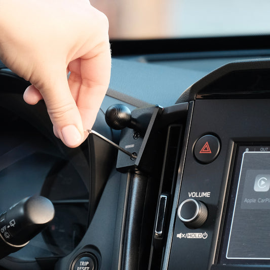 Image of Offroam Mounting Base installed securely in Subaru Forester 2025-2026. This premium all metal phone mounting base installs easily without drilling or glue. Perfect placement without blocking screens, driver view, or air flow.