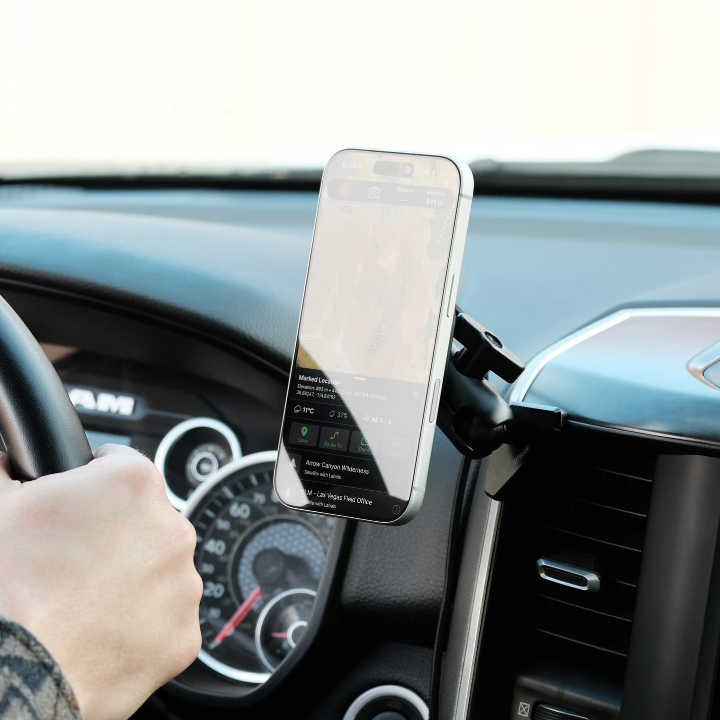 Image of Offroam MagSafe-compatible Phone Mount installed securely in Ram 1500/2500/3500 2019-2026. This premium phone mount installs easily without drilling or glue. High force magnets hold phone on any trail, road, or track. Perfect placement without blocking screens, driver view, or air flow. Fully adjustable positioning.