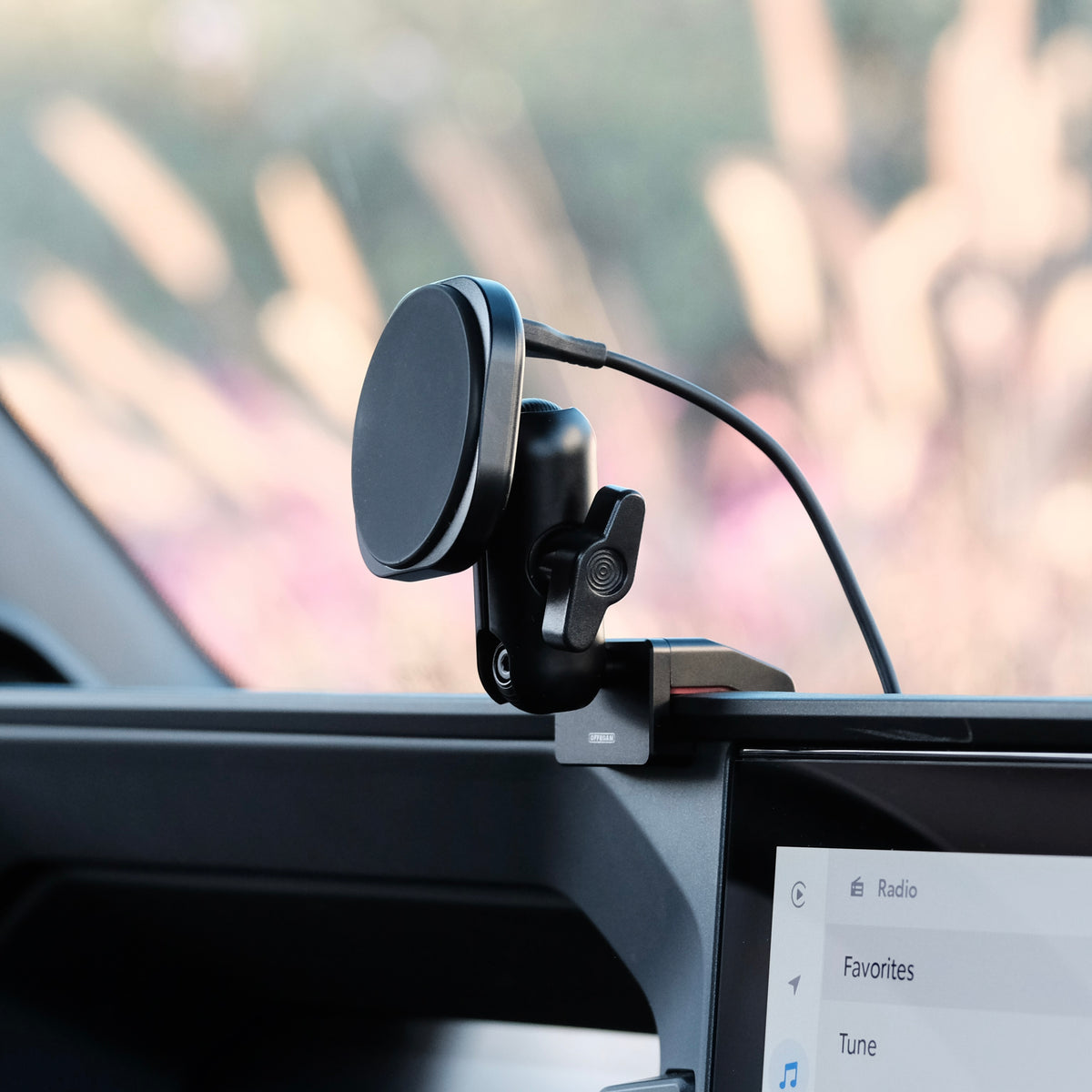 Image of Offroam MagSafe-compatible Phone Mount installed securely in Toyota Land Cruiser 250 2024-2027. This premium phone mount installs easily without drilling or glue. High force magnets hold phone on any trail, road, or track. Perfect placement without blocking screens, driver view, or air flow. Fully adjustable positioning.