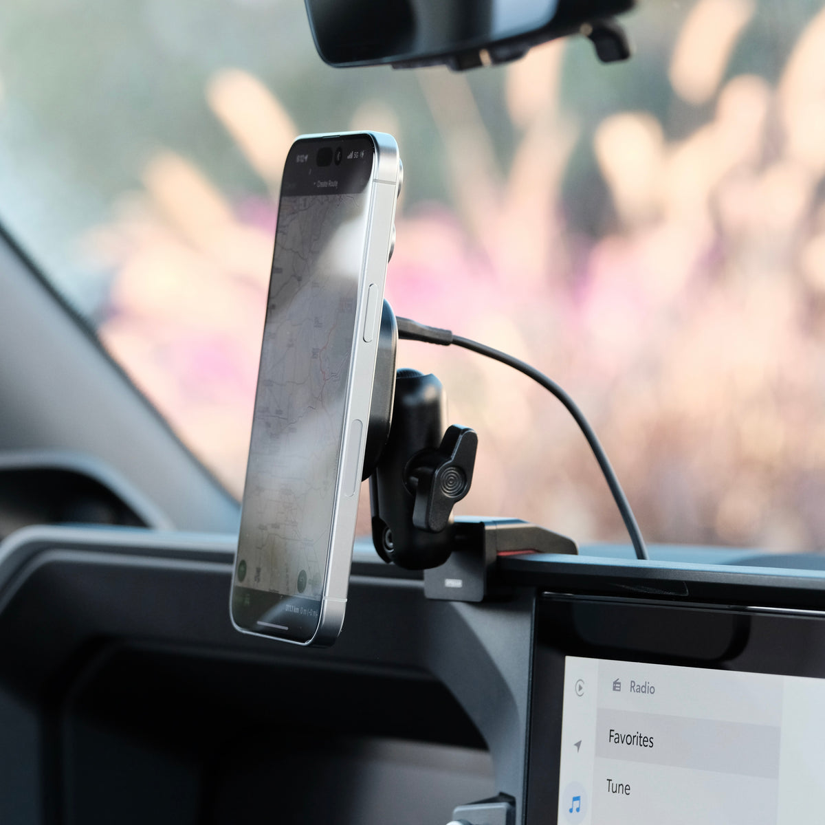 Image of Offroam MagSafe-compatible Phone Mount installed securely in Toyota Land Cruiser 250 2024-2027. This premium phone mount installs easily without drilling or glue. High force magnets hold phone on any trail, road, or track. Perfect placement without blocking screens, driver view, or air flow. Fully adjustable positioning.