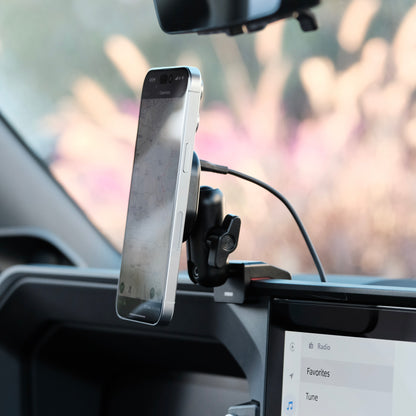 Image of Offroam MagSafe-compatible Phone Mount installed securely in Toyota Land Cruiser 250 2024-2027. This premium phone mount installs easily without drilling or glue. High force magnets hold phone on any trail, road, or track. Perfect placement without blocking screens, driver view, or air flow. Fully adjustable positioning.