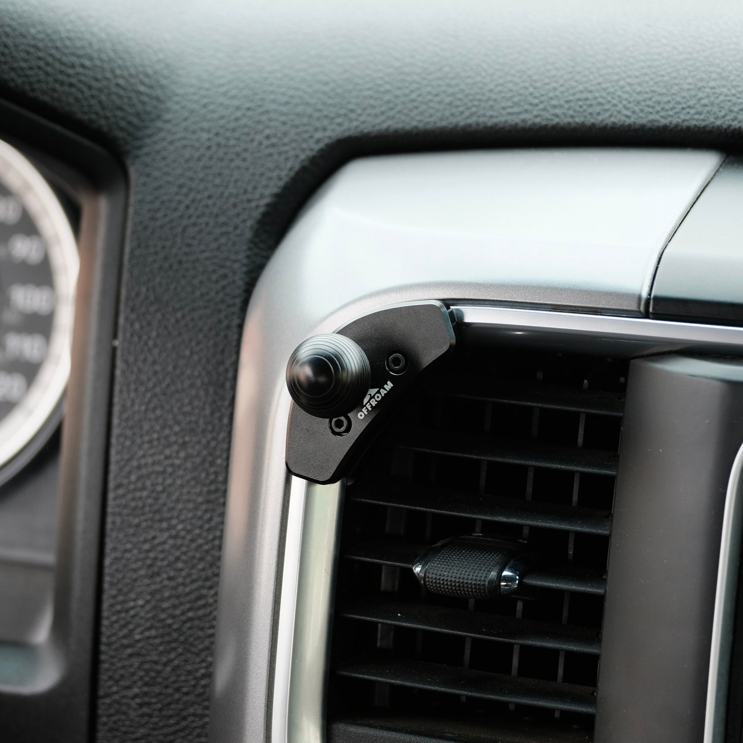 Image of Offroam Mounting Base installed securely in Ram 1500/2500/3500 2013-2018 & Ram Classic 2019-2024. This premium all metal phone mounting base installs easily without drilling or glue. Perfect placement without blocking screens, driver view, or air flow.