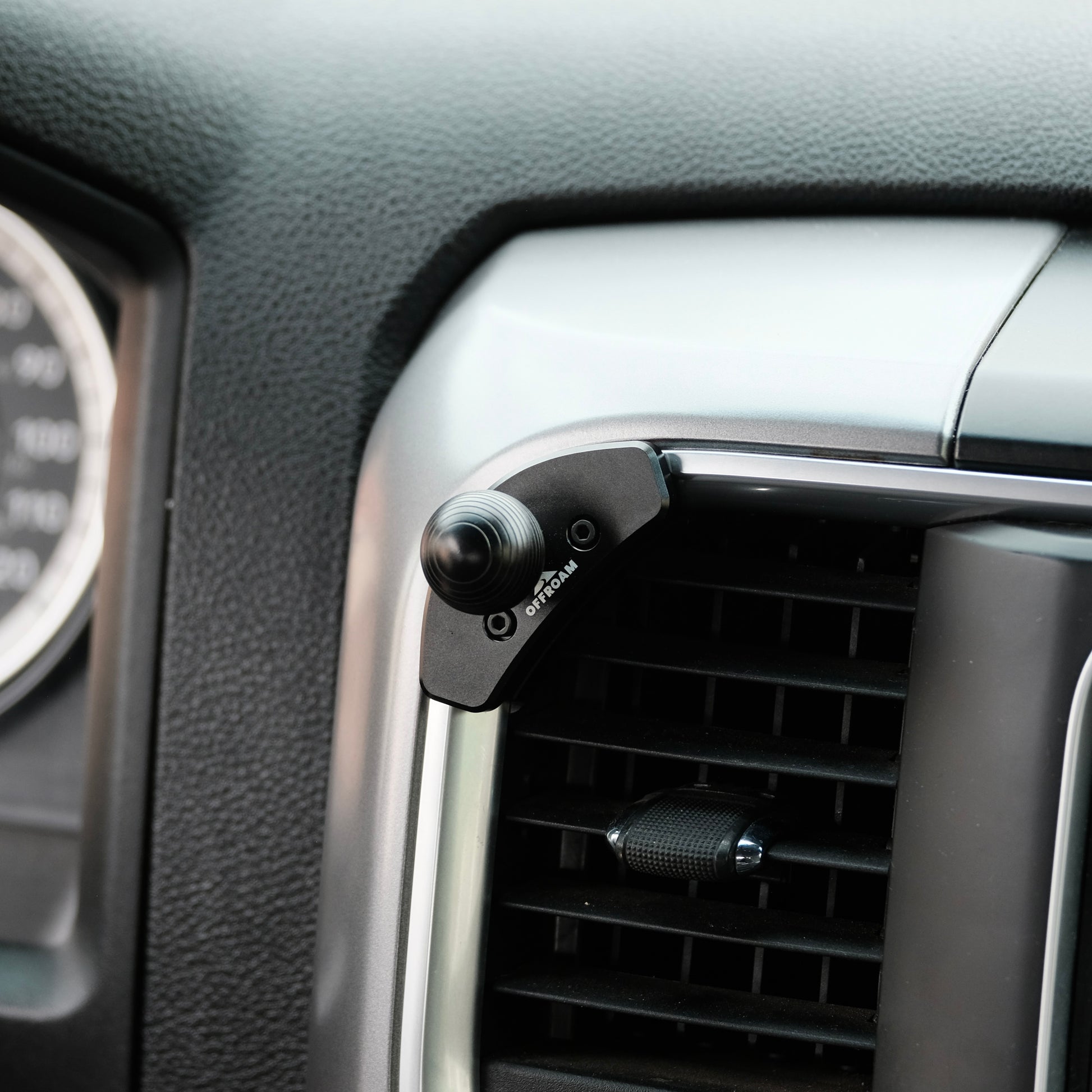 Image of Offroam Mounting Base installed securely in Ram 1500/2500/3500 2013-2018 & Ram Classic 2019-2024. This premium all metal phone mounting base installs easily without drilling or glue. Perfect placement without blocking screens, driver view, or air flow.