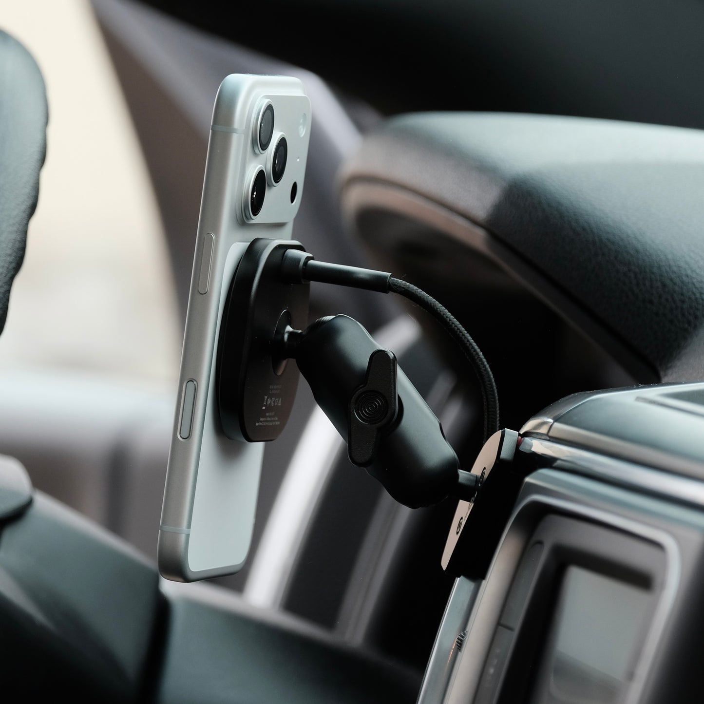 Image of Offroam MagSafe-compatible Phone Mount installed securely in Ram 1500/2500/3500 2013-2018 & 1500 Classic 2019-2024. This premium phone mount installs easily without drilling or glue. High force magnets hold phone on any trail, road, or track. Perfect placement without blocking screens, driver view, or air flow. Fully adjustable positioning.