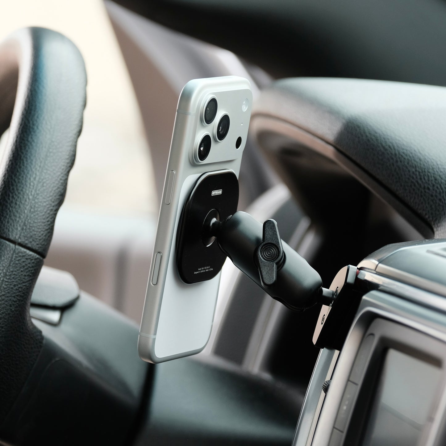 Image of Offroam MagSafe-compatible Phone Mount installed securely in Ram 1500/2500/3500 2013-2018 & 1500 Classic 2019-2024. This premium phone mount installs easily without drilling or glue. High force magnets hold phone on any trail, road, or track. Perfect placement without blocking screens, driver view, or air flow. Fully adjustable positioning.