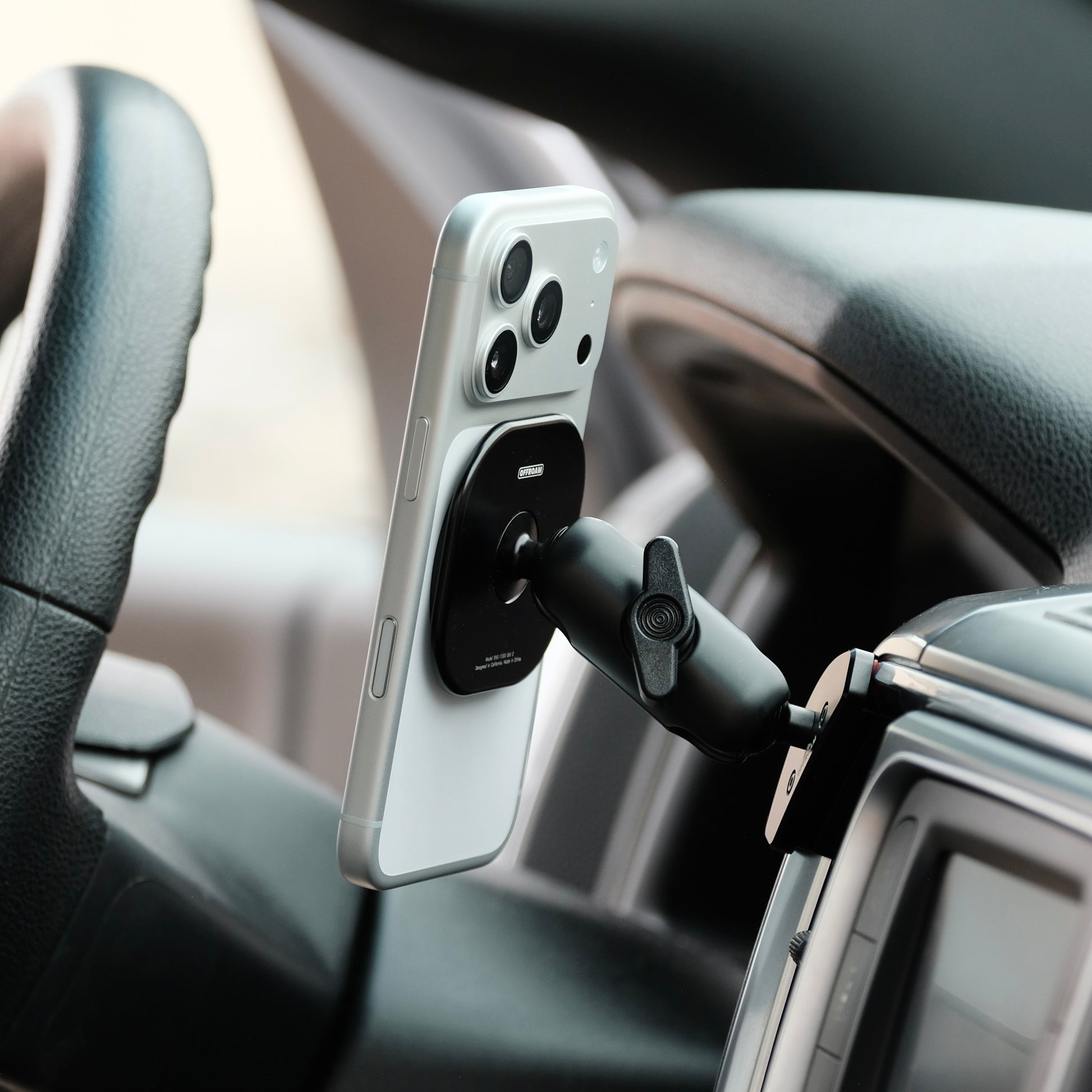 Image of Offroam MagSafe-compatible Phone Mount installed securely in Ram 1500/2500/3500 2013-2018 & 1500 Classic 2019-2024. This premium phone mount installs easily without drilling or glue. High force magnets hold phone on any trail, road, or track. Perfect placement without blocking screens, driver view, or air flow. Fully adjustable positioning.