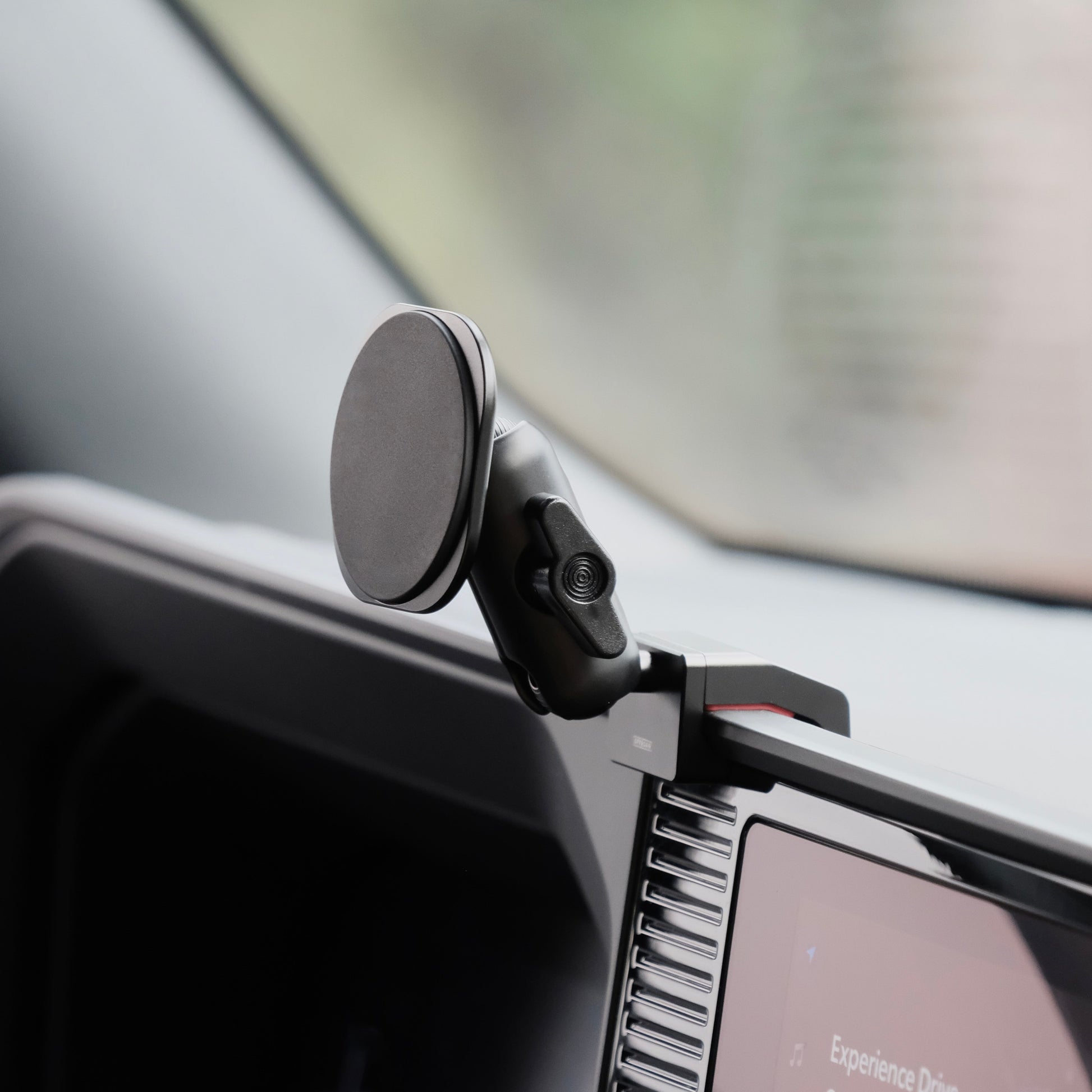 Image of Offroam MagSafe-compatible Phone Mount installed securely in Toyota Land Cruiser 250 2024-2025. This premium phone mount installs easily without drilling or glue. High force magnets hold phone on any trail, road, or track. Perfect placement without blocking screens, driver view, or air flow. Fully adjustable positioning.