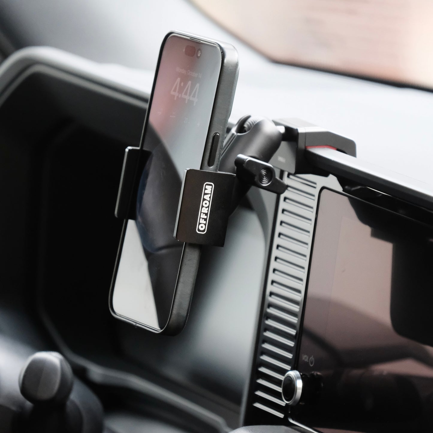 Image of Offroam Phone Mount installed securely in Toyota Land Cruiser 250 2024-2025. This premium phone mount installs easily without drilling or glue. Spring loaded Universal holder for use with any phone. Perfect placement without blocking screens, driver view, or air flow. Fully adjustable positioning.