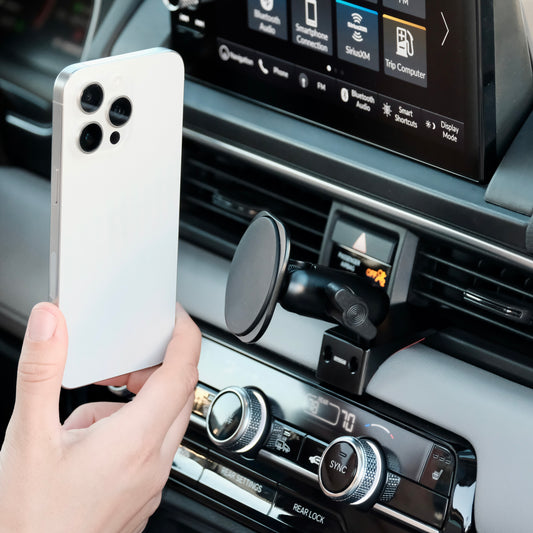 Image of Offroam MagSafe-compatible Phone Mount installed securely in Honda Pilot 2023-2025 | Passport 2026. This premium phone mount installs easily without drilling or glue. High force magnets hold phone on any trail, road, or track. Perfect placement without blocking screens, driver view, or air flow. Fully adjustable positioning.